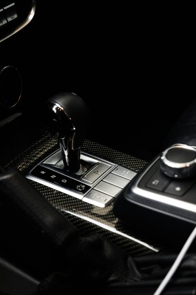 Close-up of a luxury car's automatic gear lever with sleek design elements.