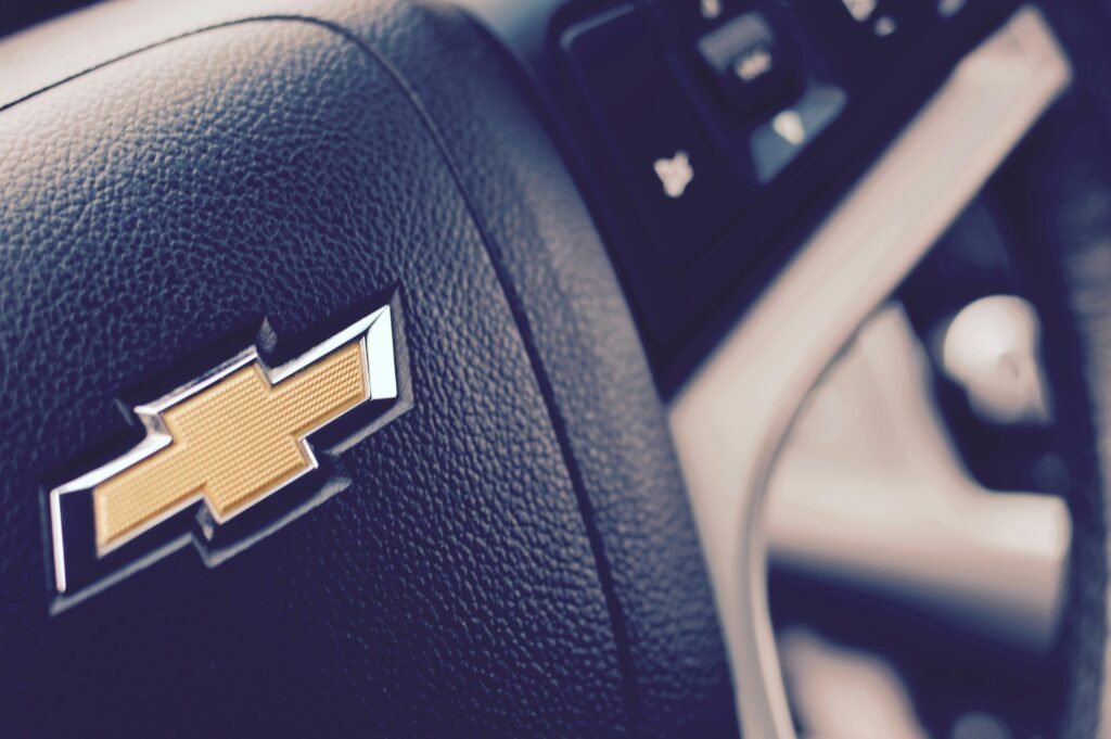 Detailed view of a Chevrolet car steering wheel showcasing the emblem.